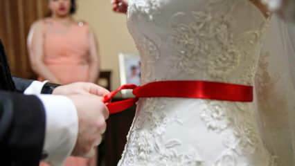 Hva er meningen med det røde båndet? Hvorfor er det røde beltet bundet til bruden?