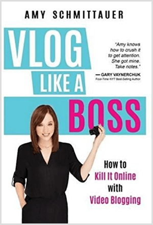 Amy Landino skrev boka Vlog Like a Boss under navnet Amy Schmittauer. Omslaget viser et bilde av Amy fra livet opp og holder et videokamera. Tittelen vises på en lyseblå bakgrunn med hvite og fuchsia bokstaver. Bokens tagline er How To Kill It Online With Video Blogging.