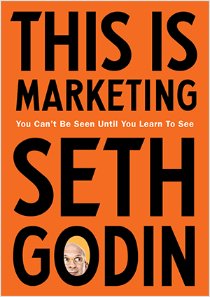 Dette er et skjermbilde av forsiden av This Is Marketing av Seth Godin. Omslaget er et loddrett rektangel med oransje bakgrunn og svart tekst. Et bilde av hodet til Seth vises i O av etternavnet hans.