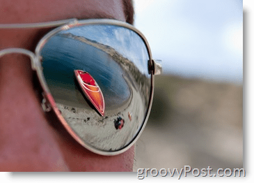 Fotografi - Blenderåpning - Solbriller med skiboatrefleksjon rød